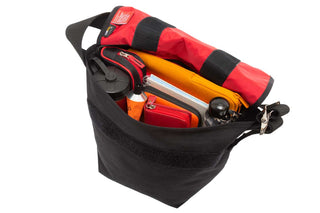 small vintage messenger bag black with laptop, cases, water bottle, umbrella inside