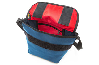 mini nylon messenger bag navy showcasing internal red details with flap open